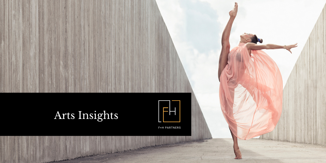 The image is of a barefoot dancer in a pink, flowing garment on her toes with one leg high in the air. There is a cement wall on the left. Overlaid on the wall is a black box with white text that says Arts Insights and the F and H Partners logo. 